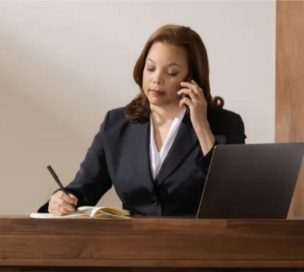 attorney on the phone and writes